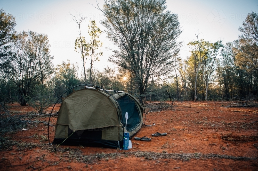 Swag setup in the red outback bush land - Australian Stock Image