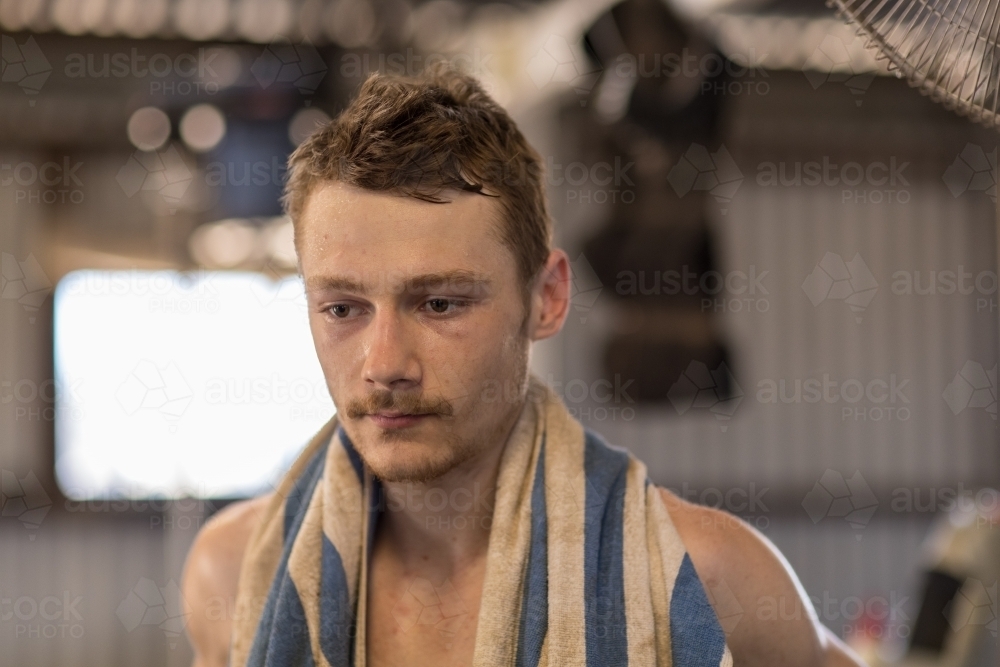 sweaty shearer with towel over shoulders - Australian Stock Image