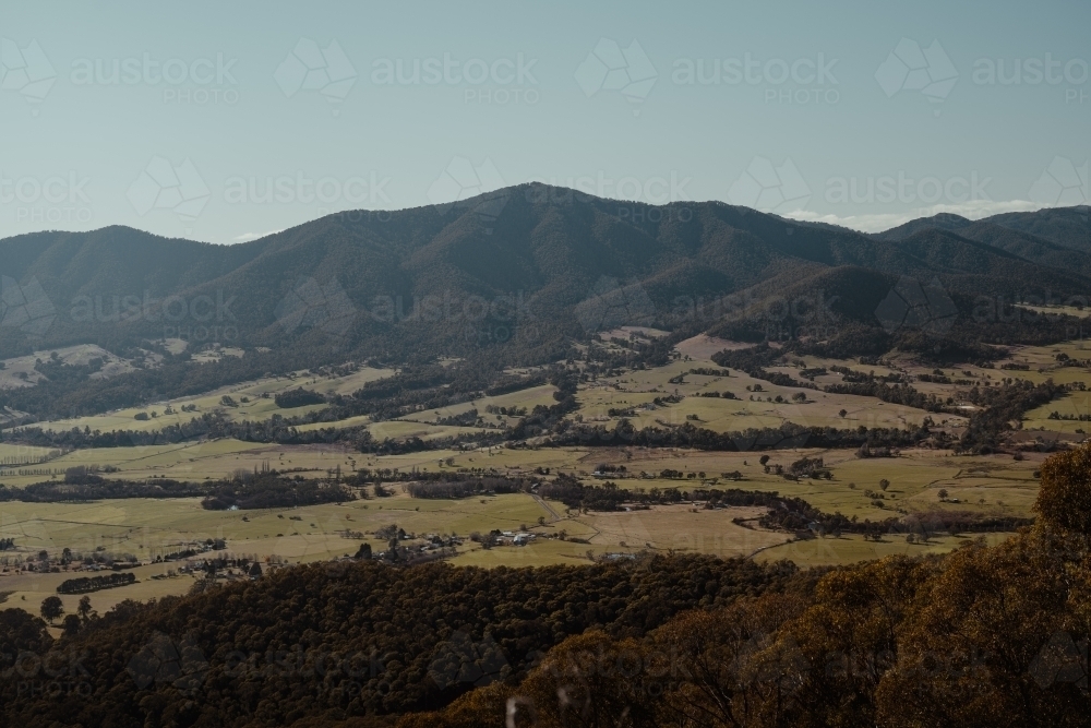 Sweeping valley views with mountains in the background near Tawonga. - Australian Stock Image