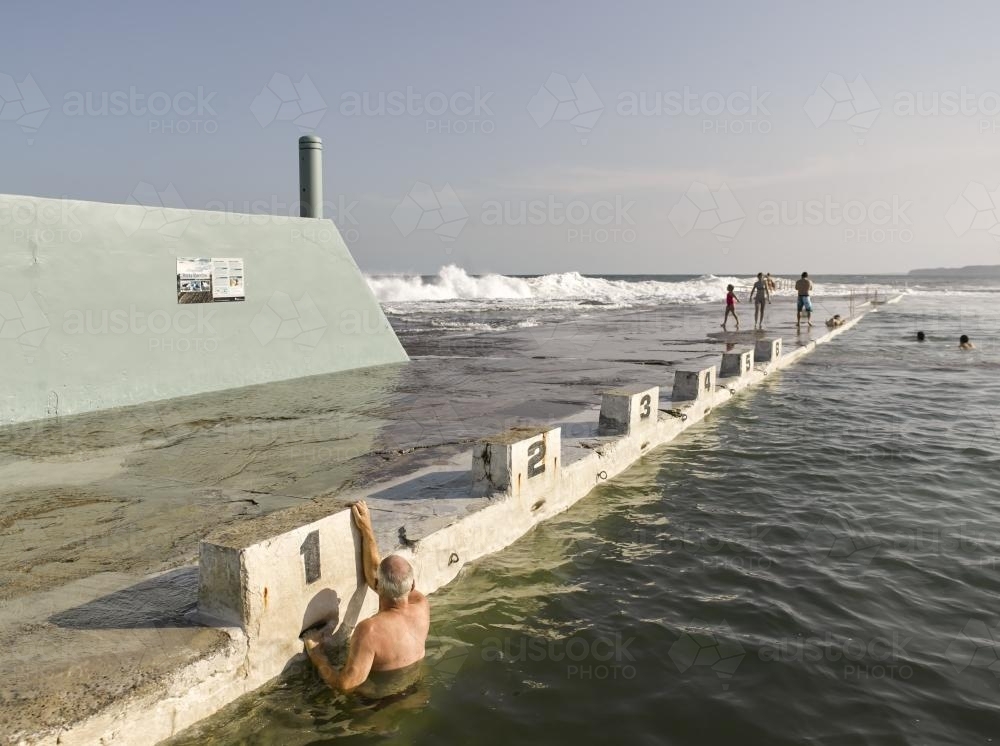 Swimmer at starting blocks in Newcastle Ocean Baths 07 - Australian Stock Image