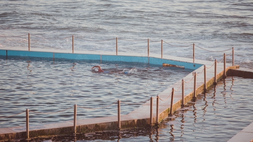Swimmer in an ocean pool - Australian Stock Image