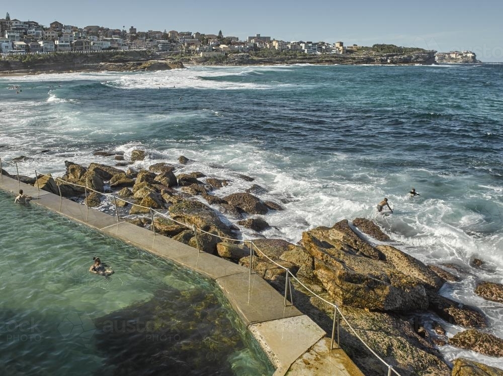 swimmers and surfers at Bronte Ocean Pool - Australian Stock Image