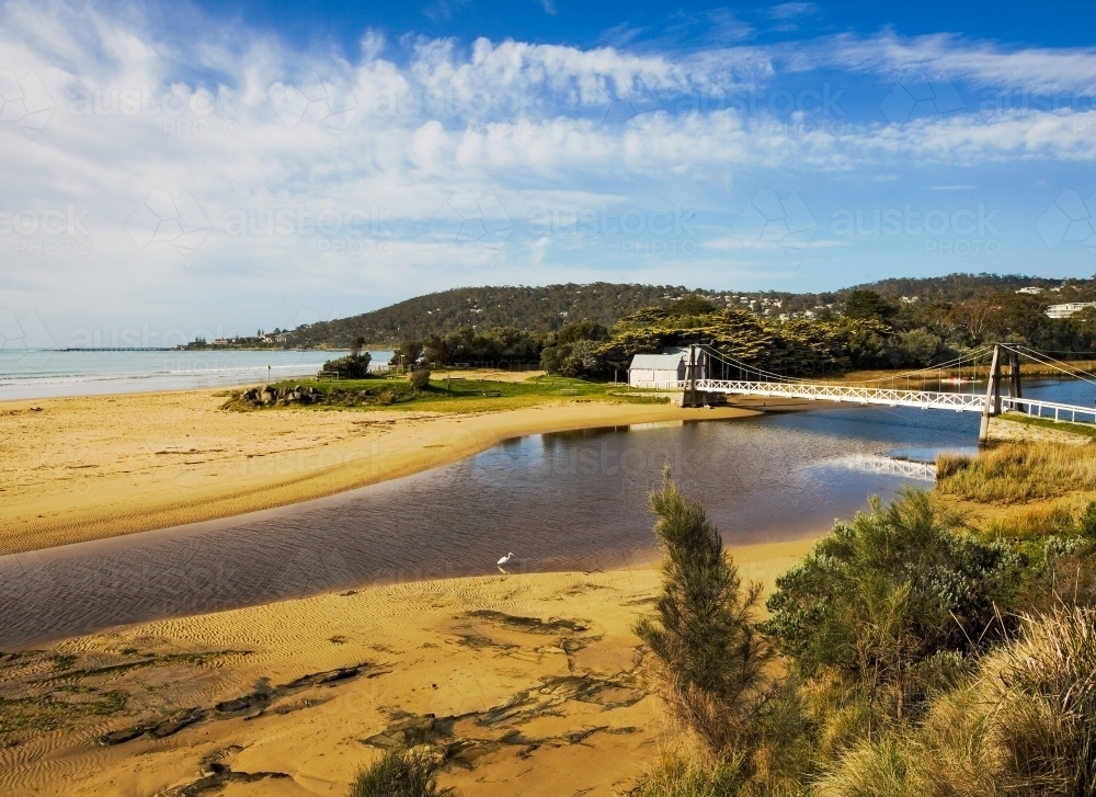 Swing bridge and river in coastal town - Australian Stock Image