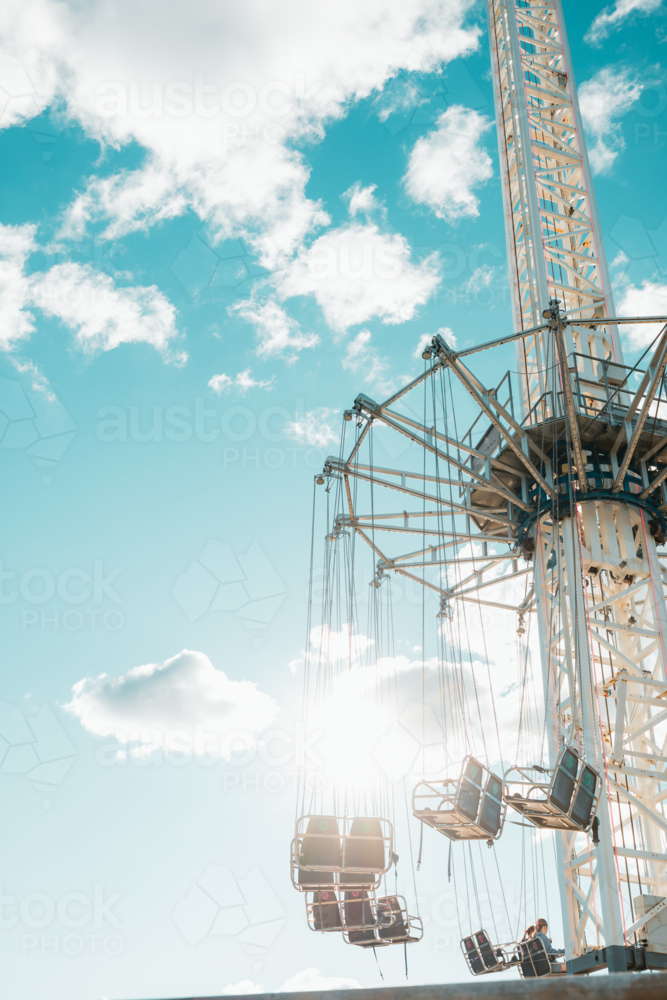 Swing chair ride at carnival in bright afternoon sunshine - Australian Stock Image