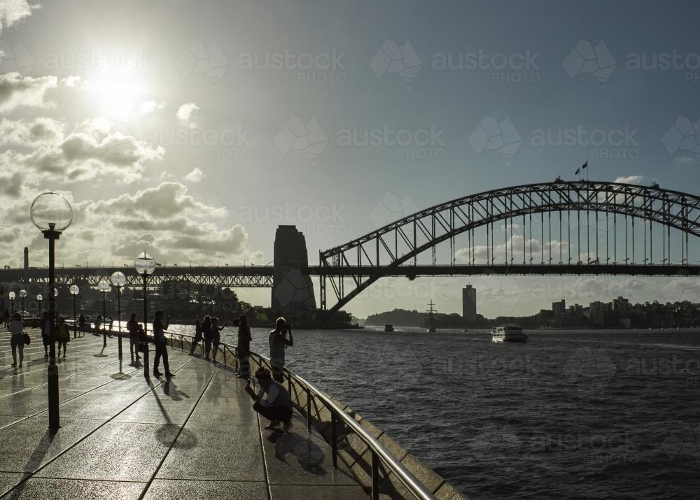 Sydney Harbour Bridge and tourists in silhouette - Australian Stock Image