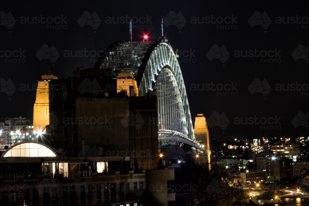 Sydney Harbour Bridge at night with city lights - Australian Stock Image