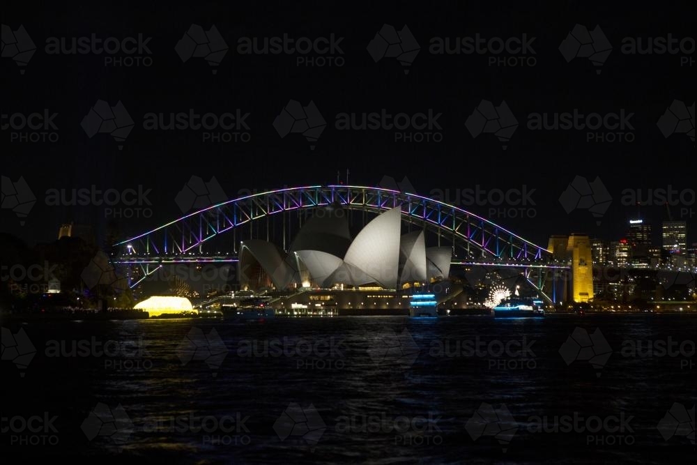 Sydney harbour in darkness with opera house and bridge - Australian Stock Image
