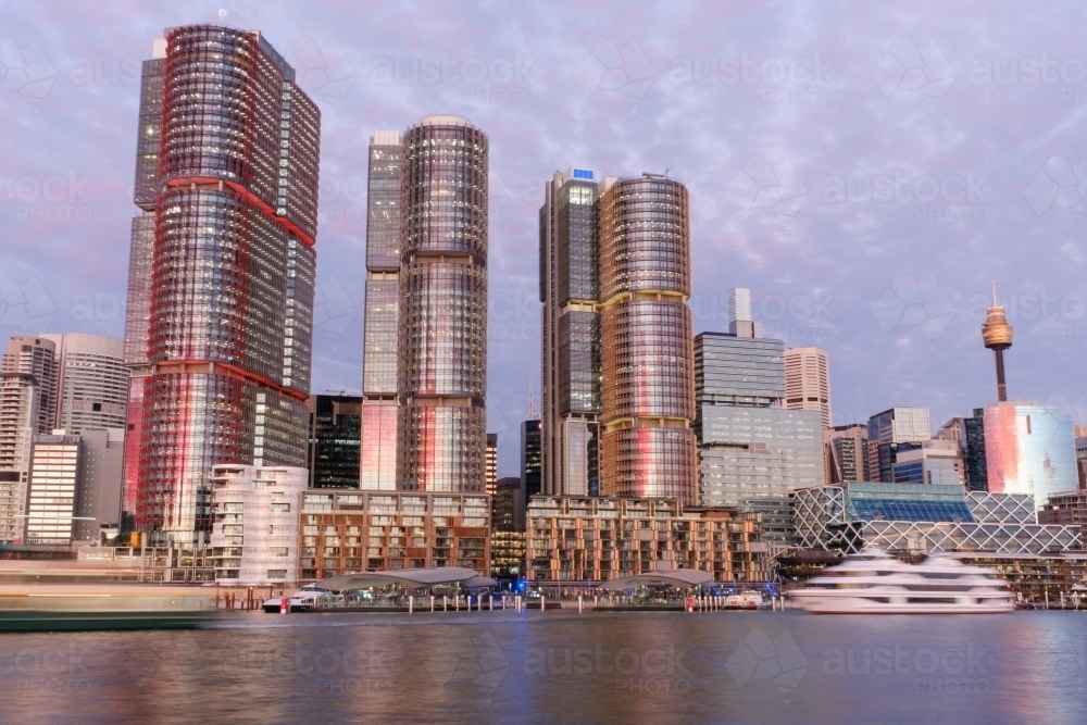Sydney waterfront buildings against purple sky - Australian Stock Image