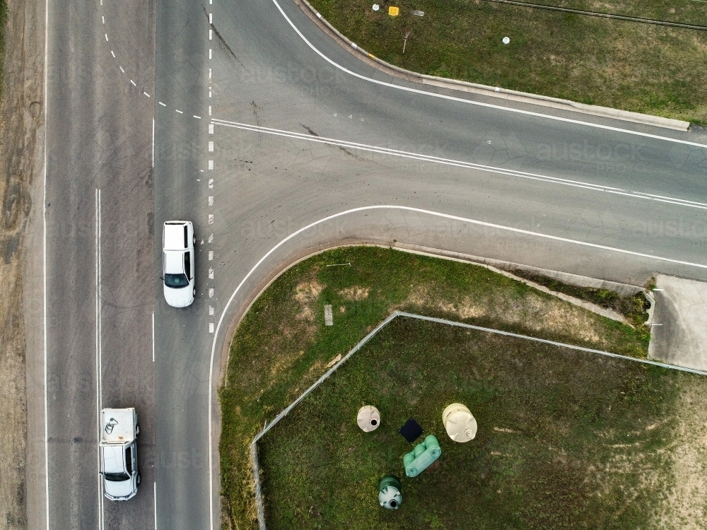 T-junction intersection of roads with cars driving along - Australian Stock Image