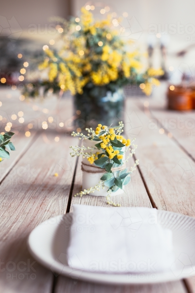 table decor wattle candle - Australian Stock Image