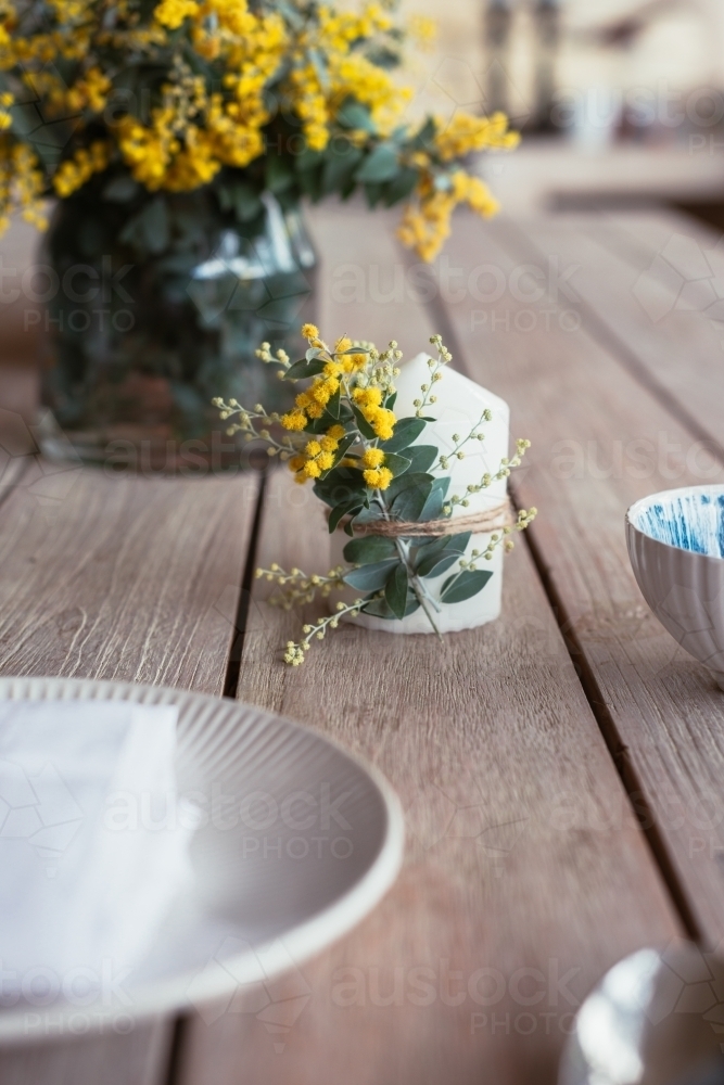 table decor with wattle candle - Australian Stock Image