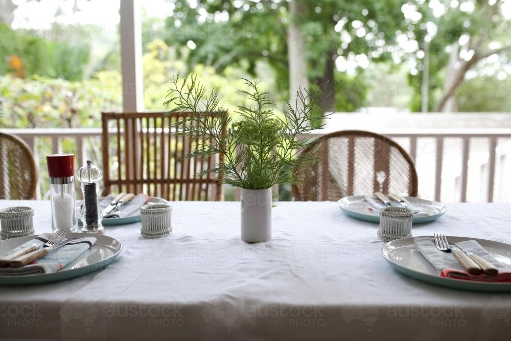 Image of Table setting for lunch on verandah - Austockphoto