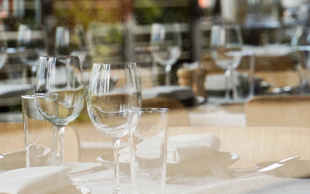 Table setting seen through glass reflection - Australian Stock Image