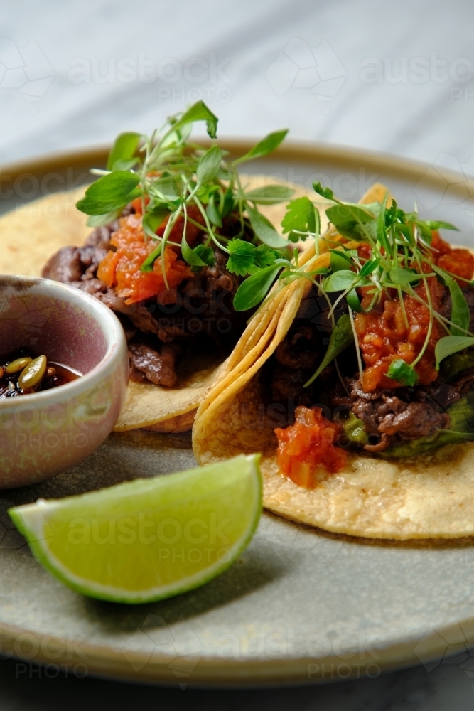 Tacos al pastor with lime - Australian Stock Image