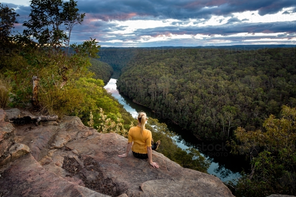 Taking in beautiful river views from mountain cliff tops - Australian Stock Image