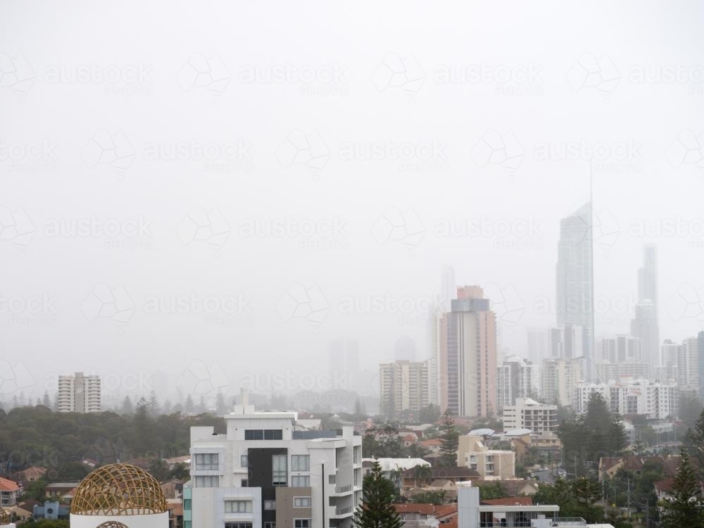Tall Gold Coast buildings in misty rain - Australian Stock Image
