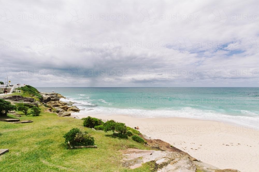 Tamarama beach with turquoise water on an overcast day - Australian Stock Image