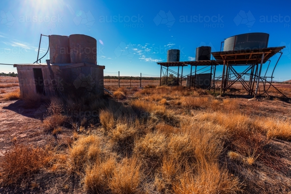 Tanks and old shack in outback Australia - Australian Stock Image