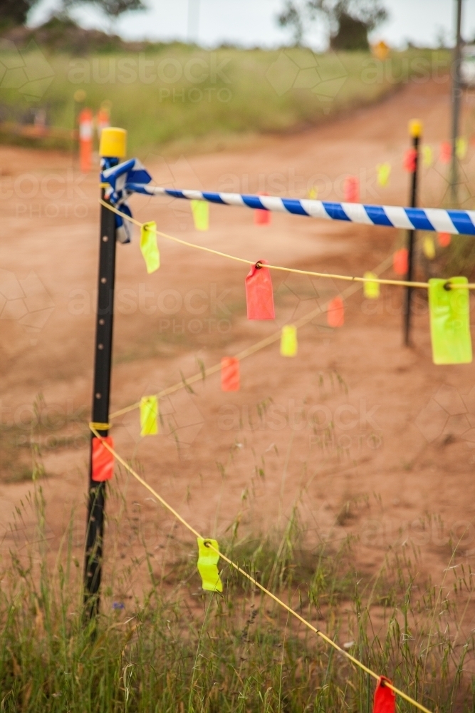 Tape and tags blocking off new road being built - Australian Stock Image