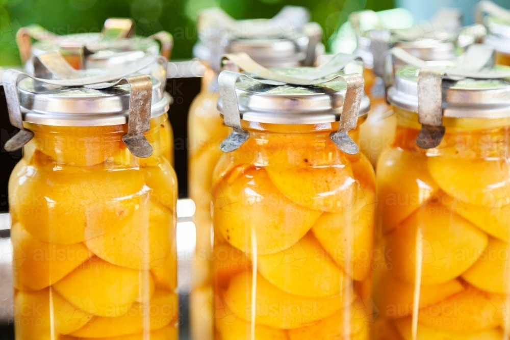 Image of Tasty fresh homemade preserved apricot fruit in glass jar
