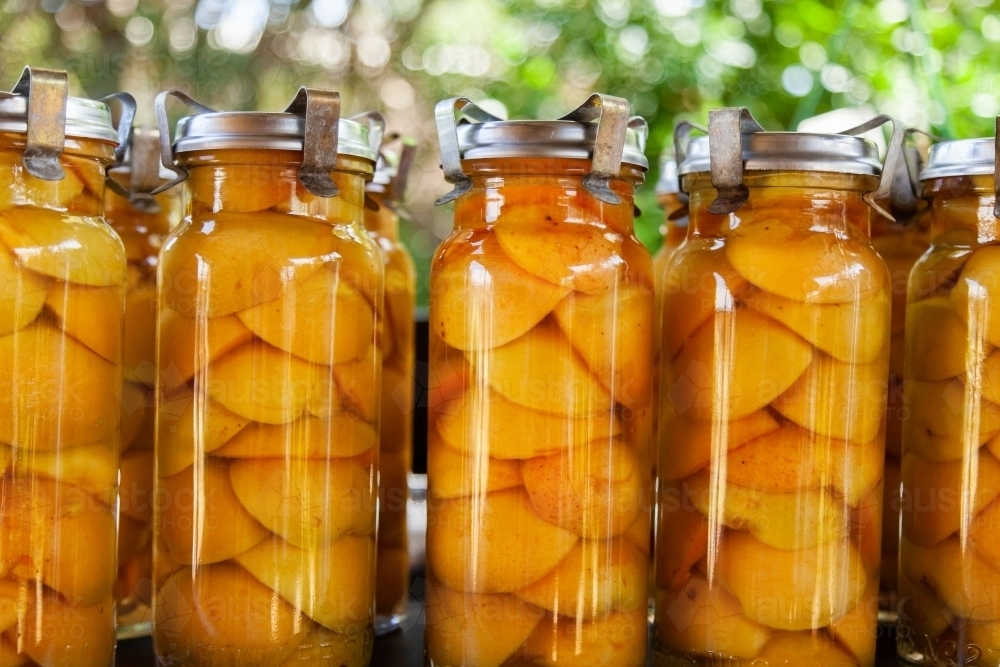 Tasty fresh homemade preserved apricot fruit in glass jar - Australian Stock Image