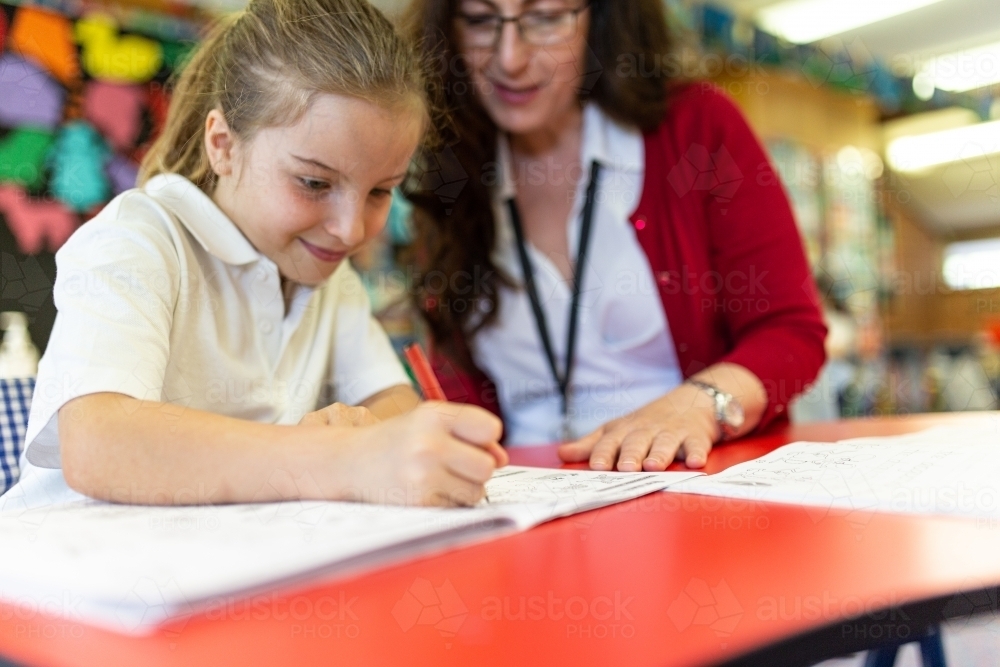 Teacher Helping Student Draw - Australian Stock Image