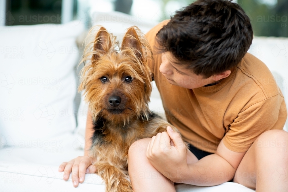 teen boy with his dog - Australian Stock Image