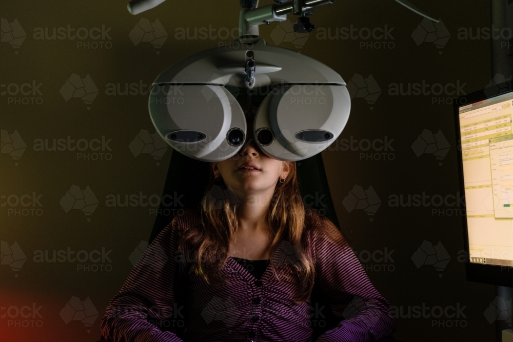 Teen girl at the optometrist - Australian Stock Image