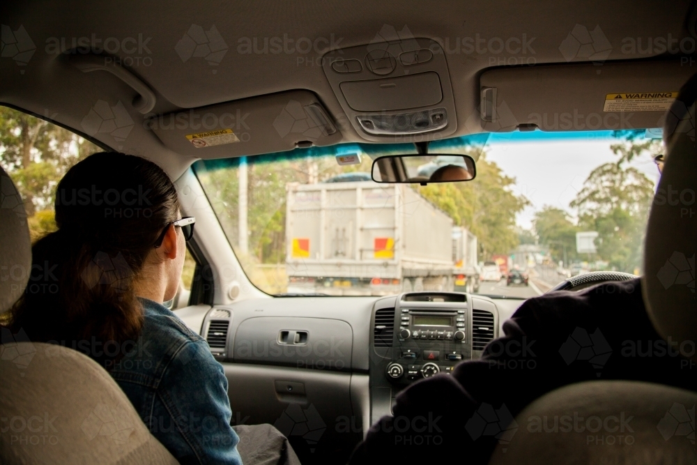 Teen girl navigating on road trip - Australian Stock Image