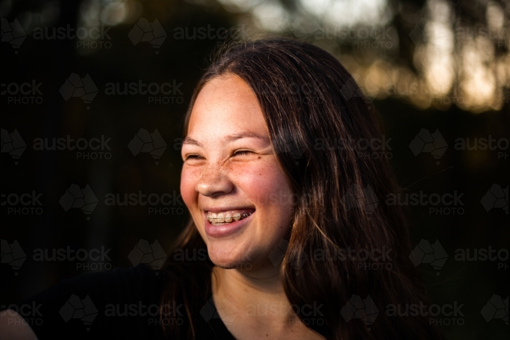 teen girl with braces laughing - Australian Stock Image