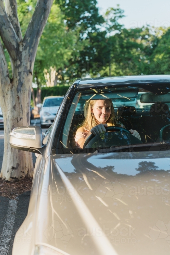 teen learner driver in parked car - Australian Stock Image