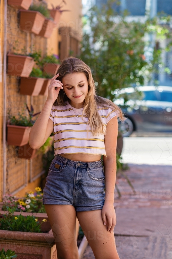 teen portrait, girl looking down - Australian Stock Image