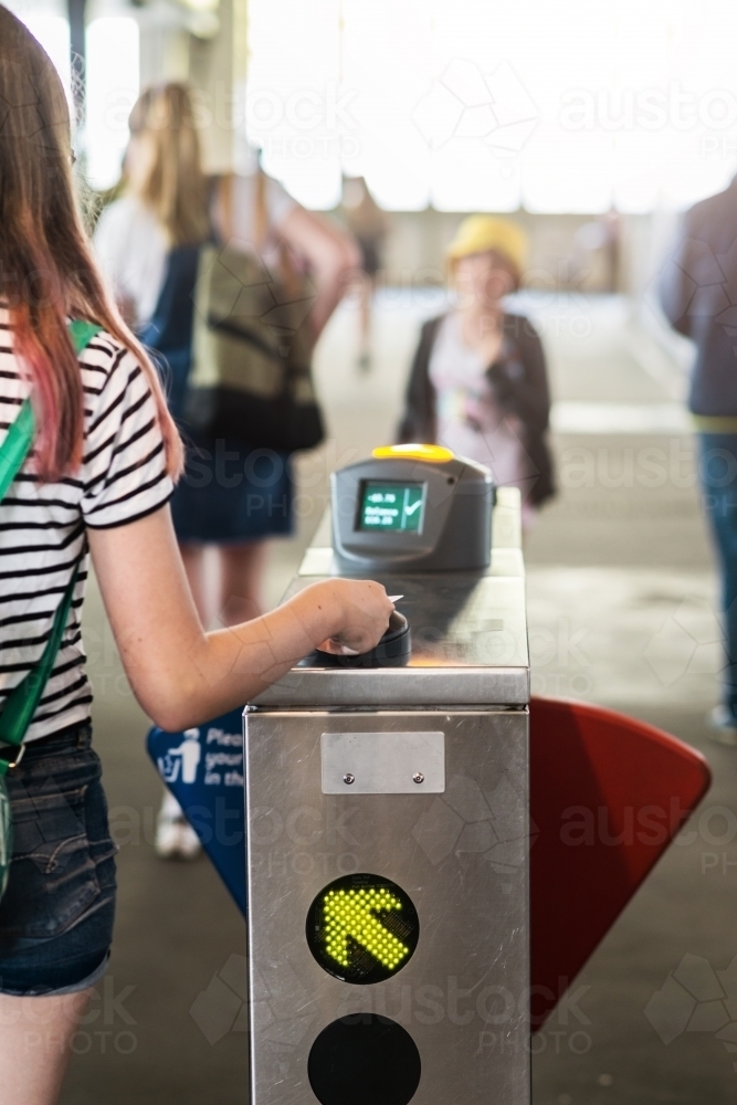 teen using travel card at ferry - Australian Stock Image