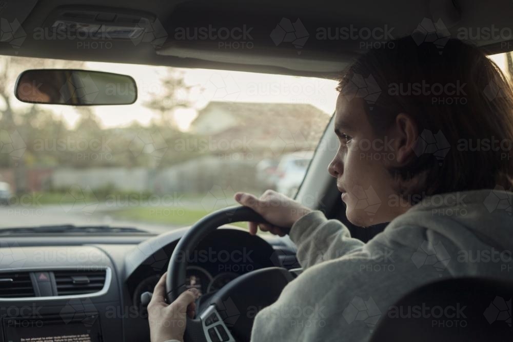 teenage boy driving - Australian Stock Image