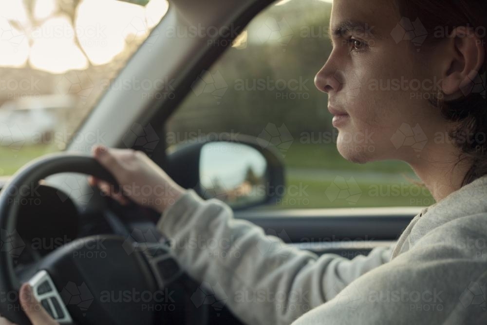 teenage boy driving - Australian Stock Image