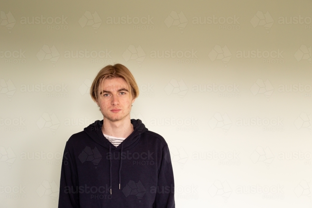 Teenage boy looking at camera - Australian Stock Image