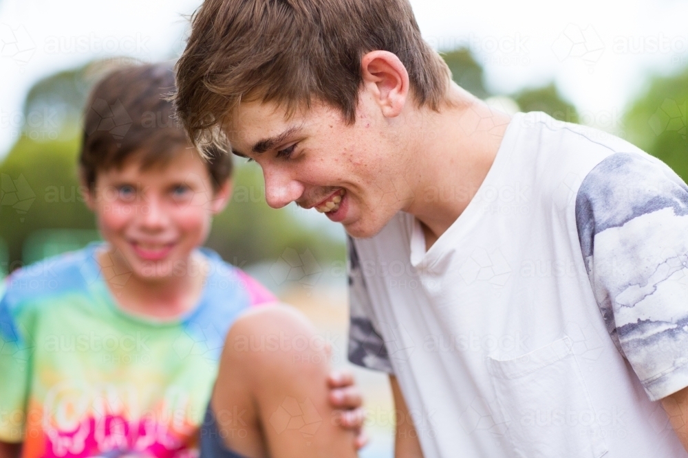 Teenage boy with his little brother - Australian Stock Image