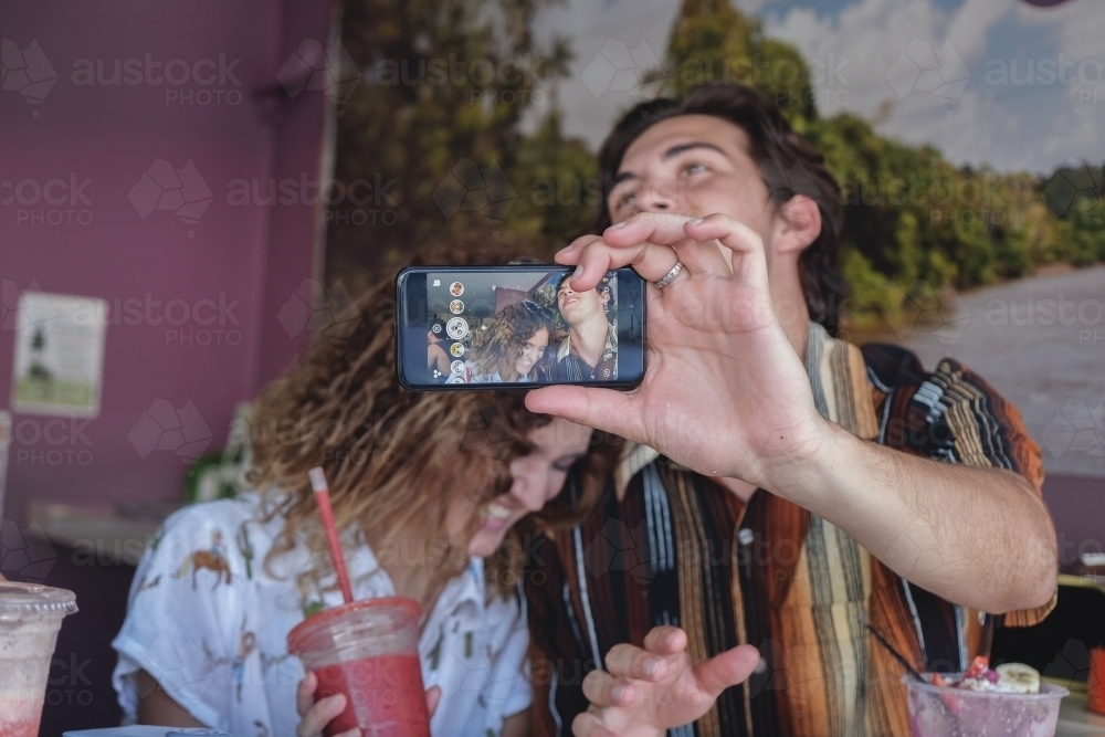 Teenage couple taking selfie - Australian Stock Image
