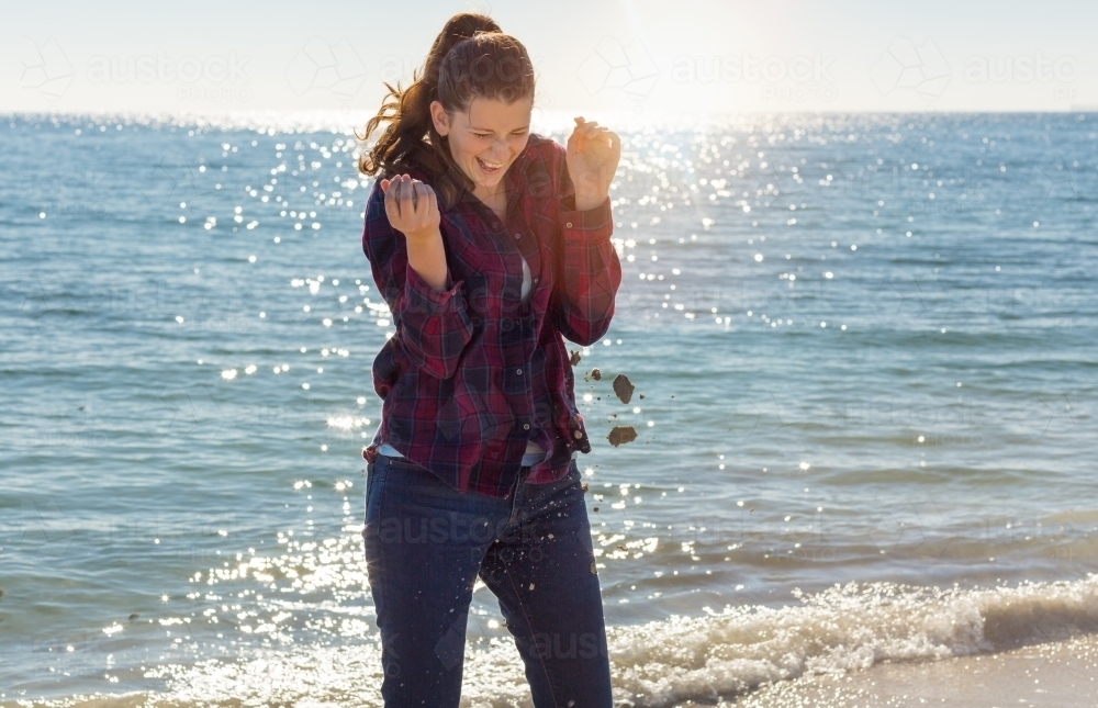 Teenage girl on the beach in sand fight - Australian Stock Image