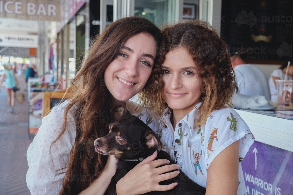 Teenage girls with dog - Australian Stock Image