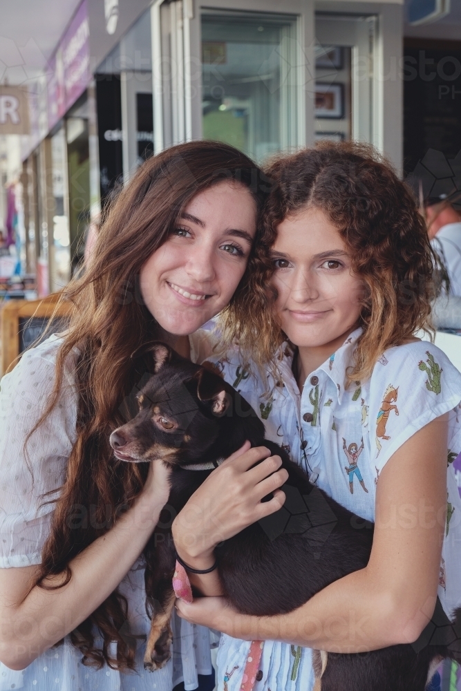 Teenage girls with dog - Australian Stock Image