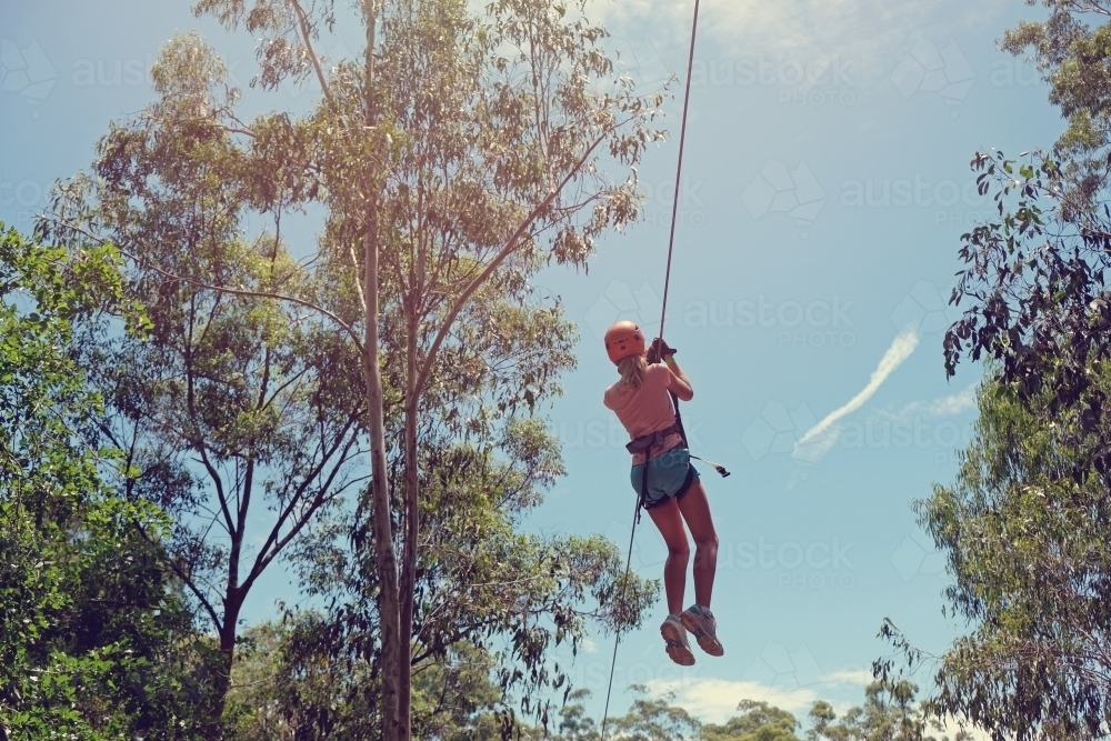 teenager girl on zipline - Australian Stock Image