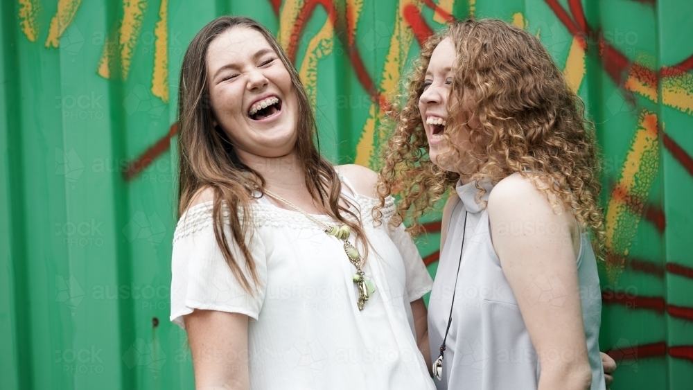 Teenager girls really laughing - Australian Stock Image