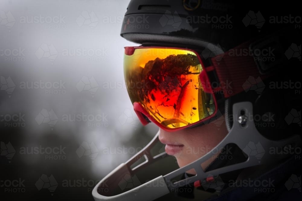 Teenager ready to ski the slopes with helmet and goggles - Australian Stock Image