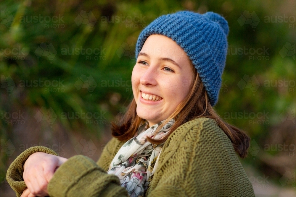 Teenager wearing warm knitted clothing - Australian Stock Image