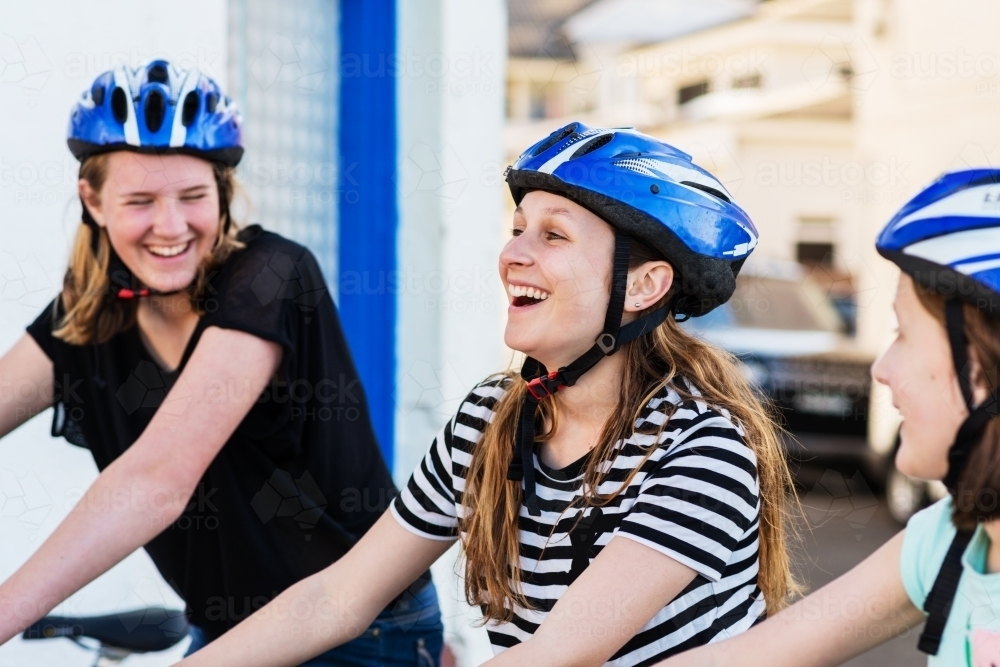 teens out riding a bike - Australian Stock Image