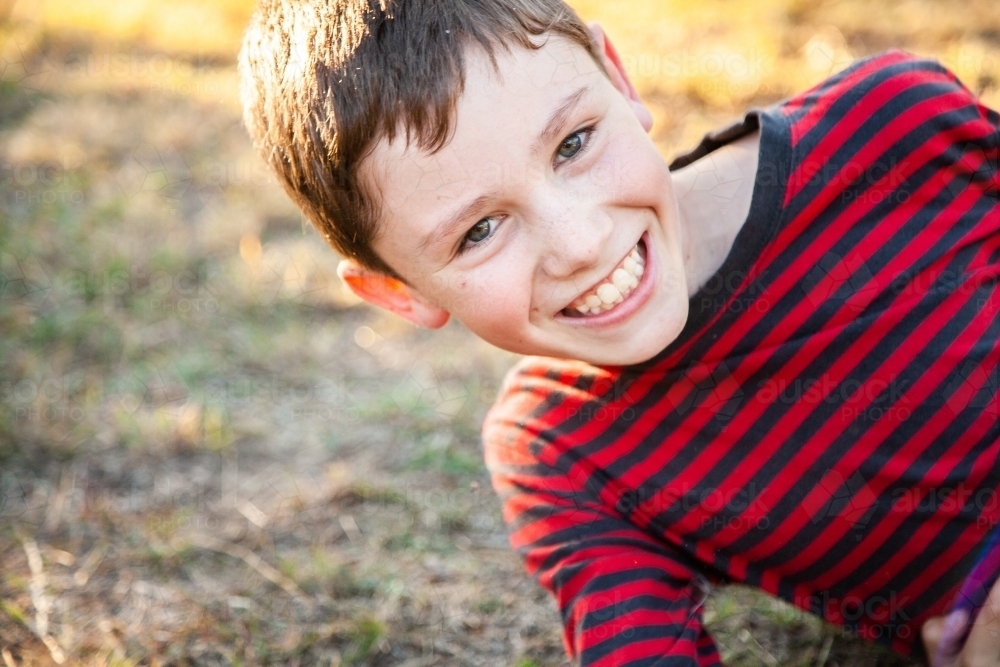 Ten year old boy with big grin on face - Australian Stock Image