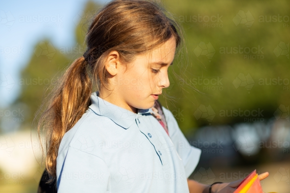 Ten year old school girl with long hair in ponytail - Australian Stock Image