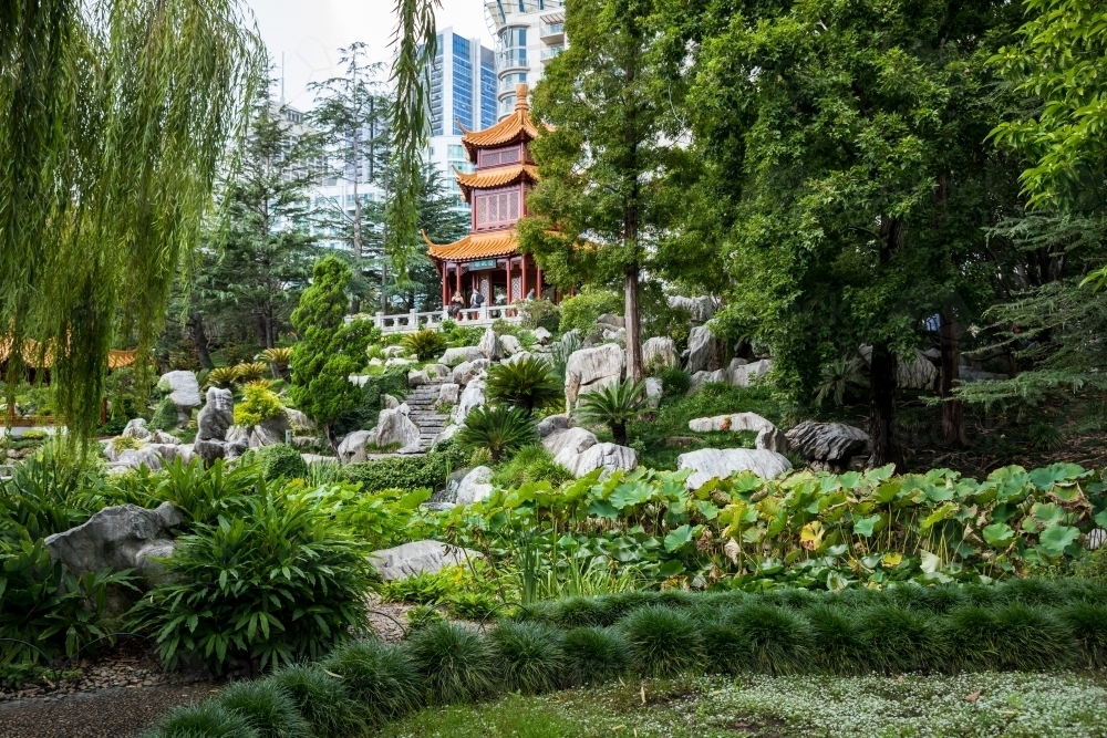 terraced garden with pavilion up to pavilion with city in background - Australian Stock Image