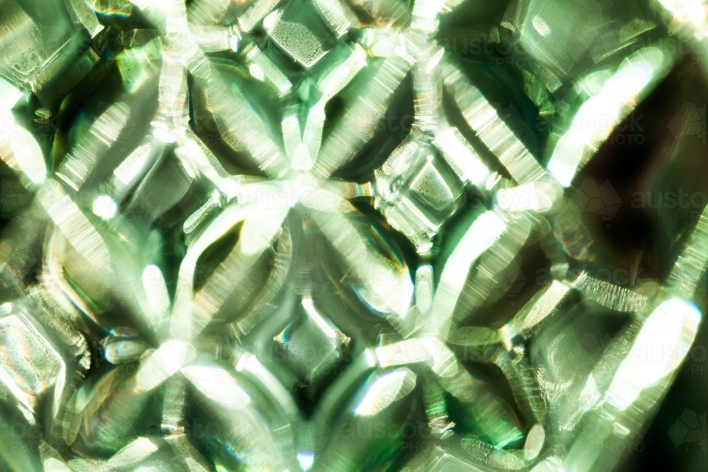 Texture of light in sparkling bright green patterns - Australian Stock Image